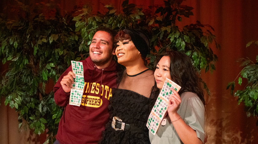 Jujubee posing with students holding up bingo cards
